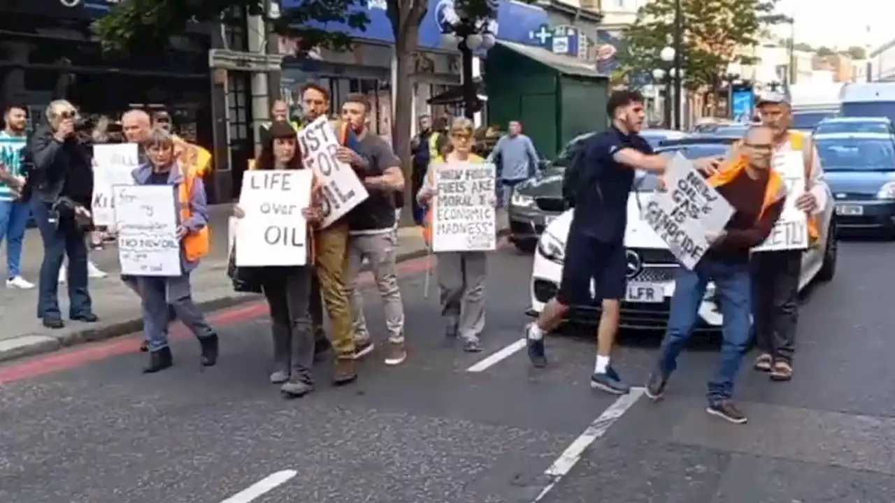 Just Stop Oil protesters shoved off the road during slow march in London