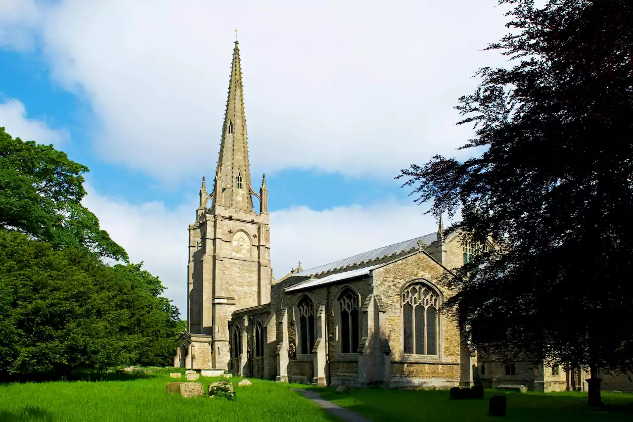 Mystery as woman found dead in churchyard as cops probe 'unexplained' death