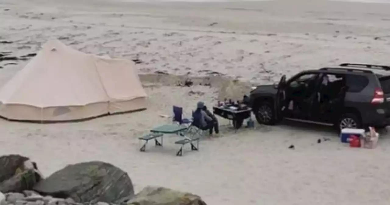 Outrage as family drive car onto protected Scots beach and pitch up tent