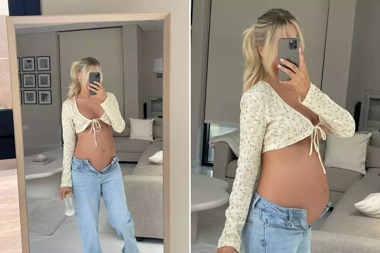 Pregnant Hayley Hughes goes braless as she shows off growing baby bump ahead of birth