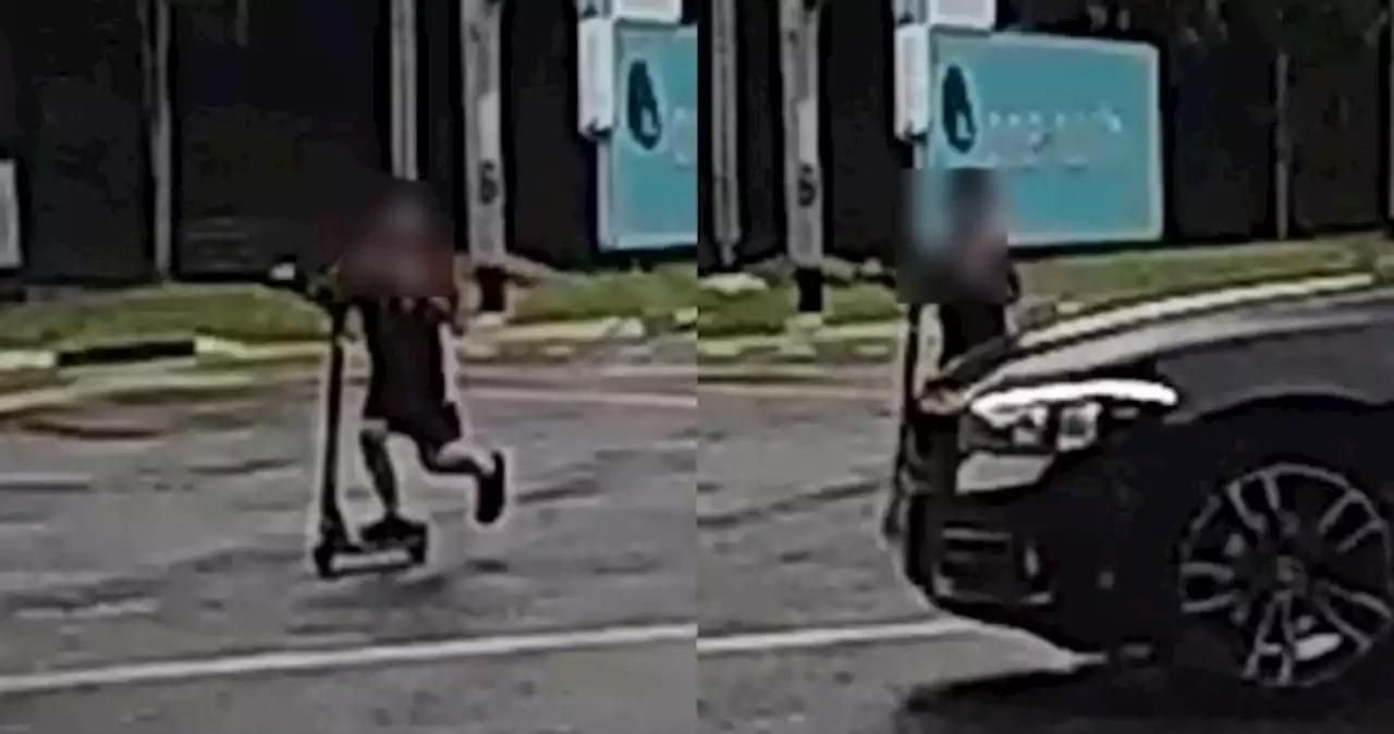 'This isn't Shibuya crossing': Boy on kick-scooter nearly hit by oncoming car while illegally crossing busy road junction