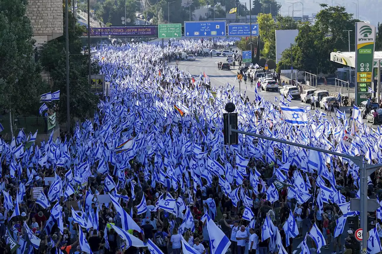 Hundreds of thousands march in Israel, as former security chiefs call for halt to legal overhaul