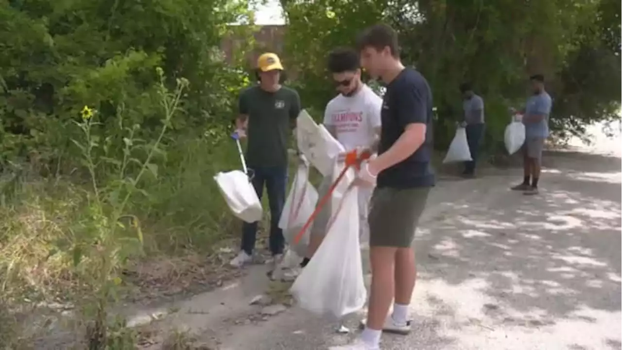 University of Houston student volunteers clean up around Hennessy Park