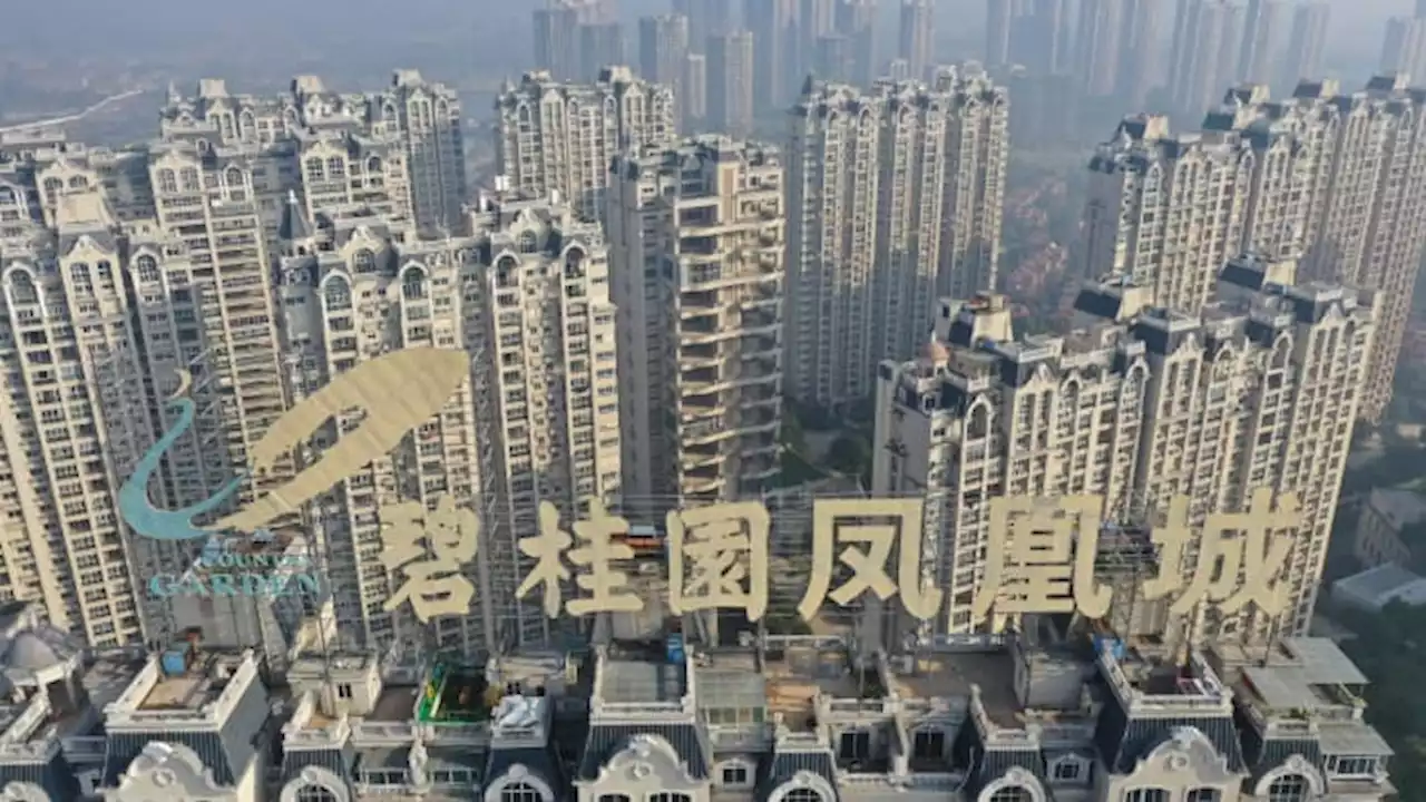 China property stocks tumble on renewed debt fears