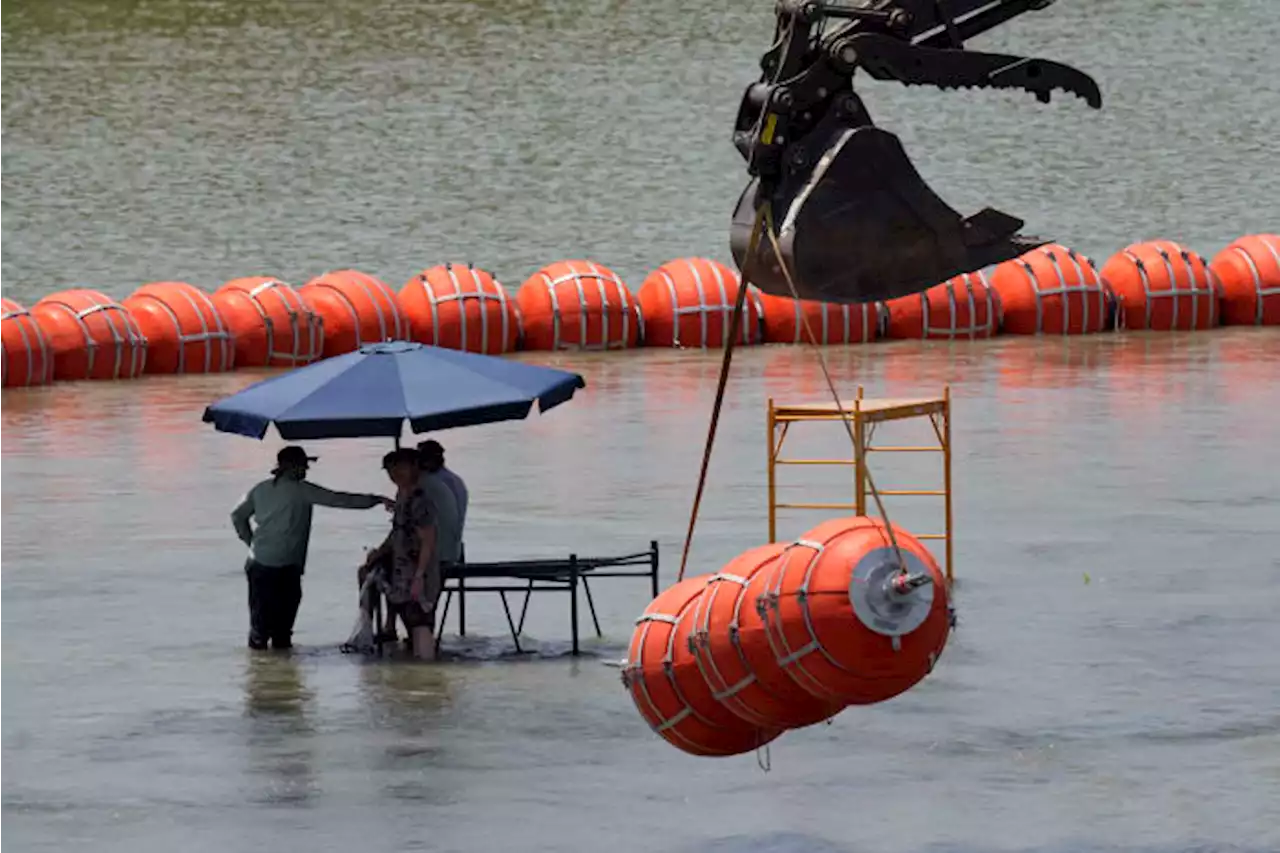 Texas Gov. Greg Abbott defends buoys on the Rio Grande as Justice Department threatens to sue