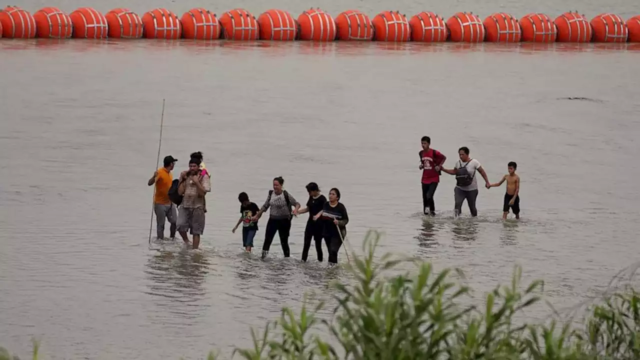 DOJ sues Texas and Gov. Abbott over use of buoys in Rio Grande to stop migrants