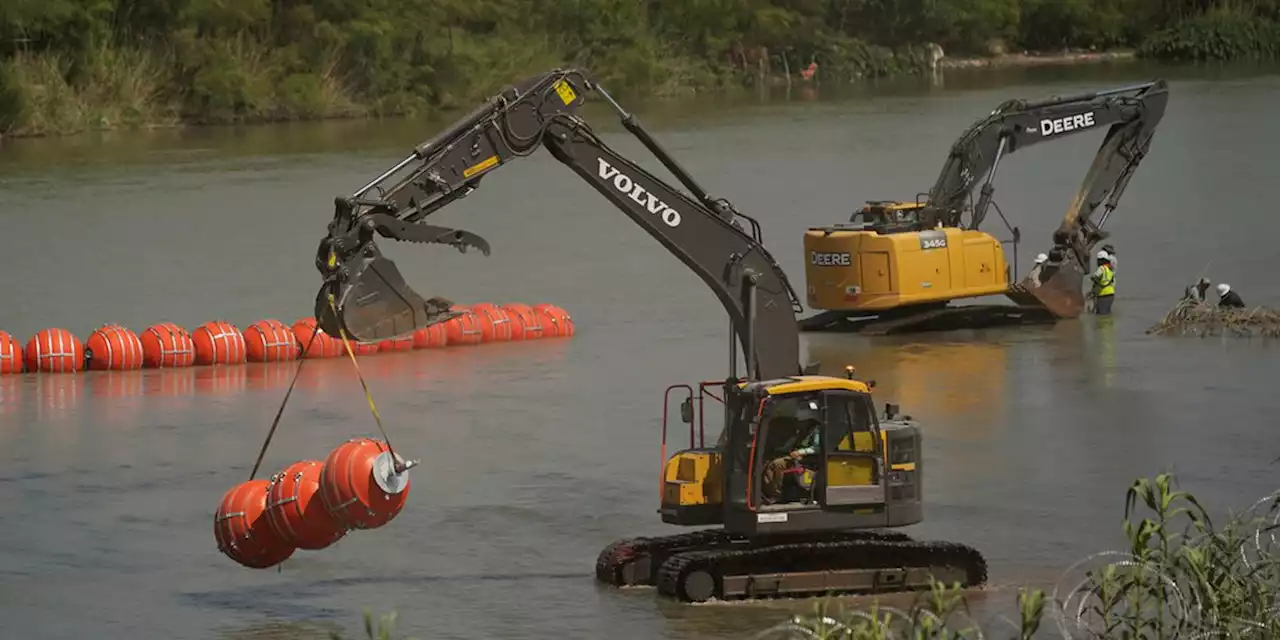 Biden administration sues Texas governor over Rio Grande buoy barrier that’s meant to stop migrants