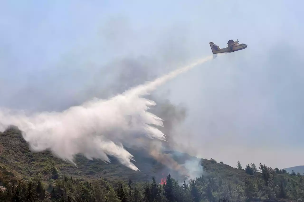 Firefighting plane crashes in Greece, killing both pilots, as island blazes force new evacuations