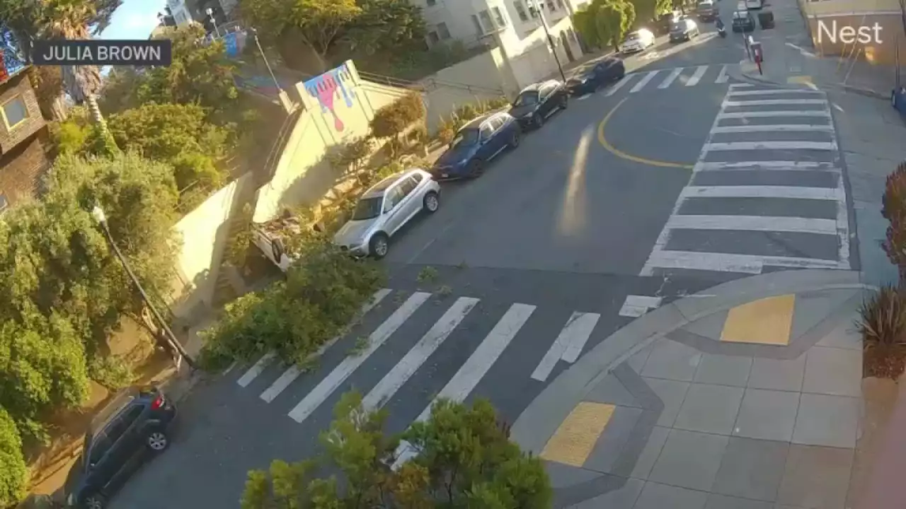 Video shows speeding car drive over San Francisco embankment, land upside down