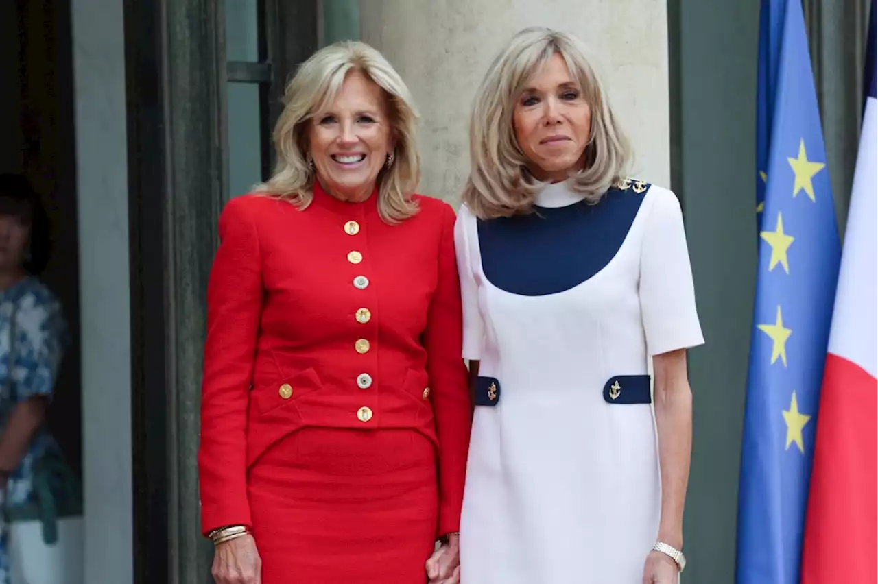 Jill Biden Goes Red in Schiaparelli and Brigitte Macron Contrasts in Nautical White Dress at Elysée Palace Meeting in Paris