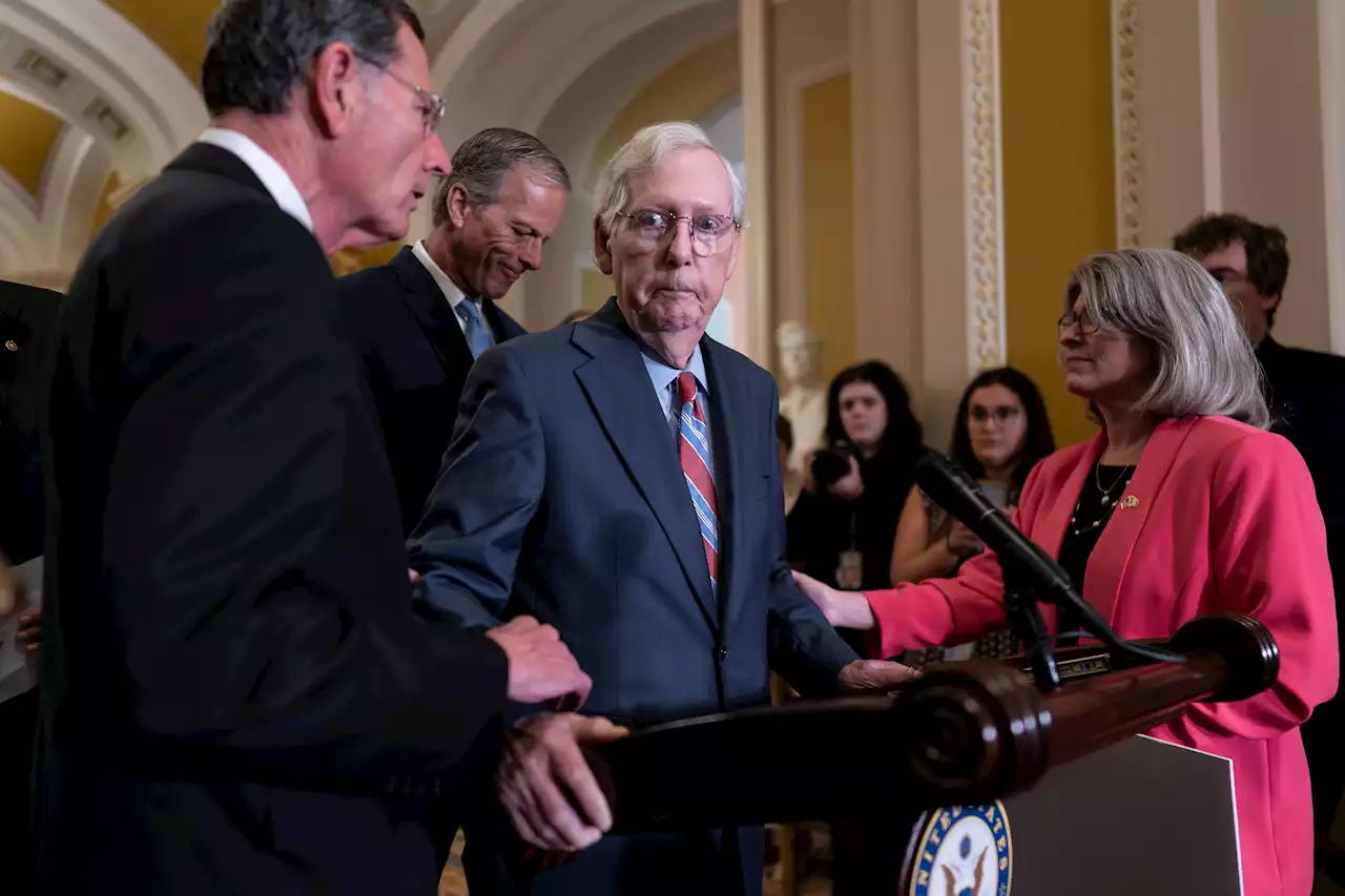 Mitch McConnell escorted away from cameras after freezing mid-press conference