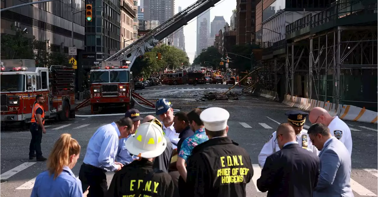 New York crane snaps and crashes into street, injuring six