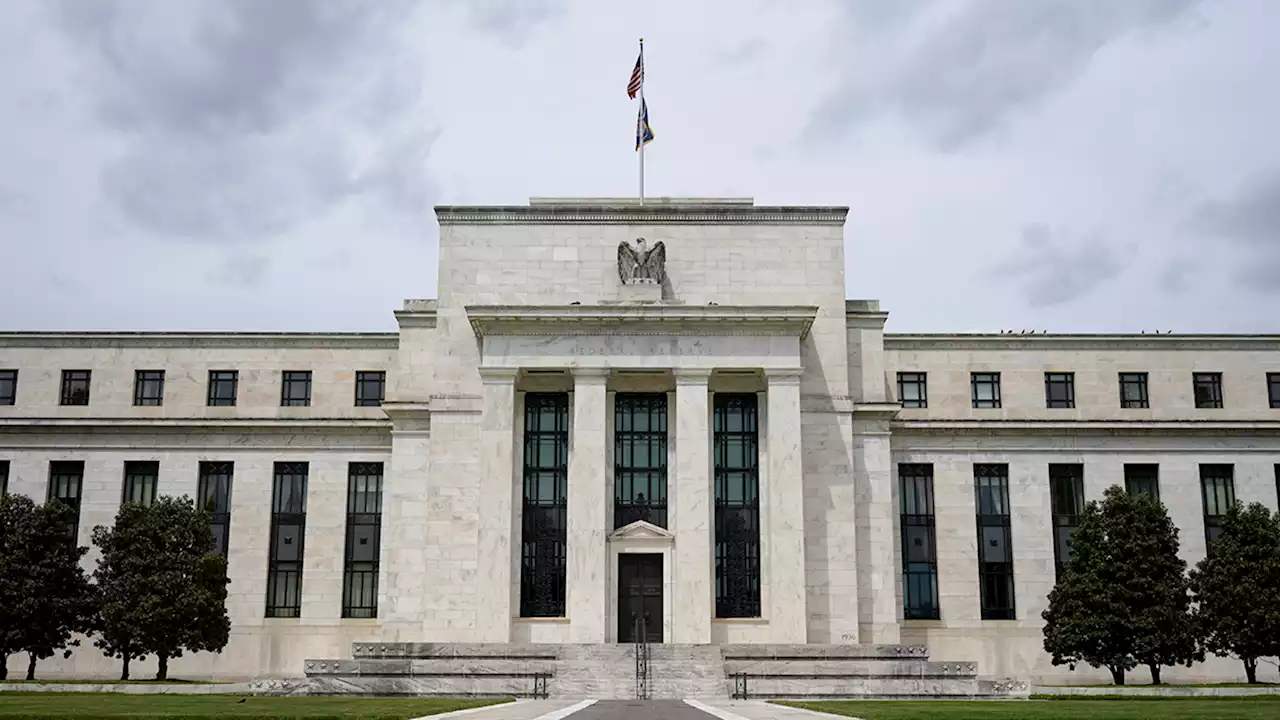 The Fed hikes interest rates by a quarter point and hints at another increase this year