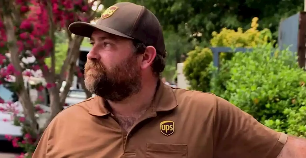 UPS driver praised for kicking down door, saving dogs from house fire