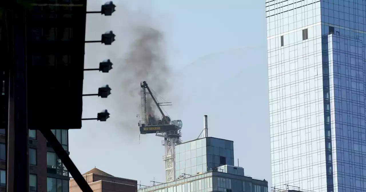 Pedestrians scatter as fire causes New York construction crane’s arm to collapse and crash to street