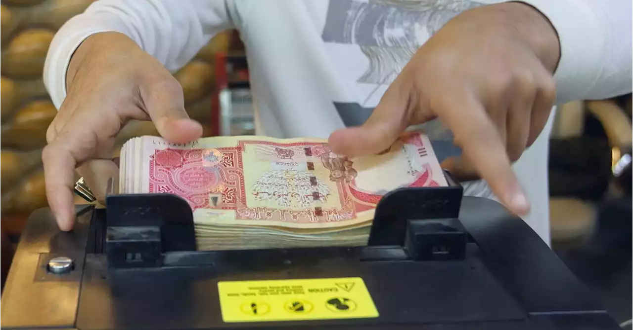 Sanctioned Iraqi banks say they are ready to face audit, warn of dinar slide