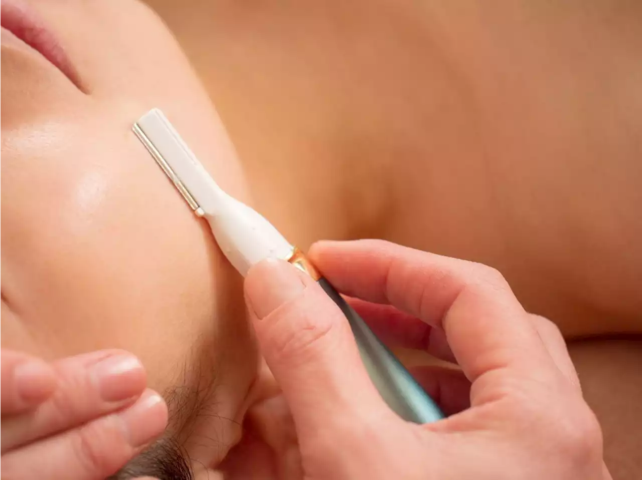 What is dermaplaning, and why is this beauty technique considered controversial?