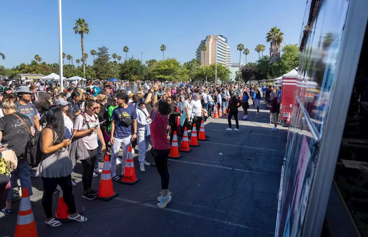 Can’t get enough Taylor Swift? Thousands of fans line up bright and early to buy branded merchandise