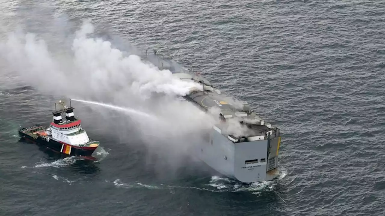 Burning cargo ship off Dutch coast will be towed to a new location after flames and smoke subsided