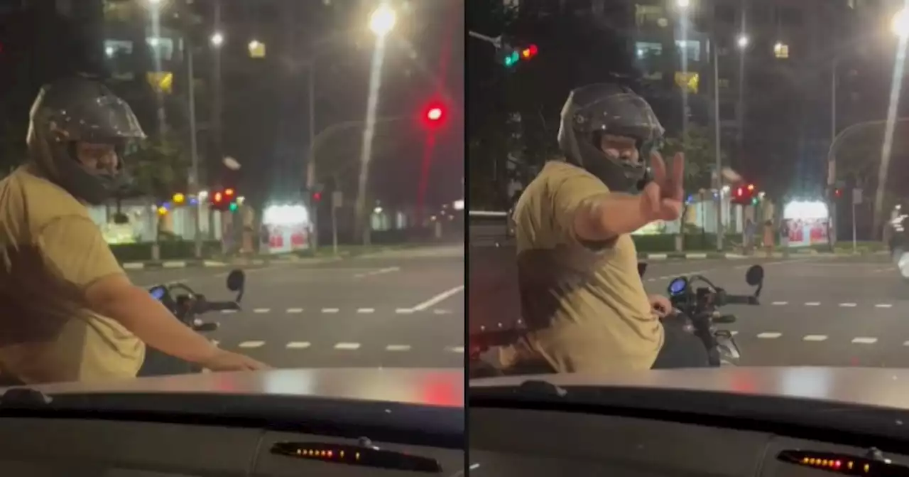 Man on motorcycle seen caressing car hood goes viral for 'cuteness overload' - Singapore News