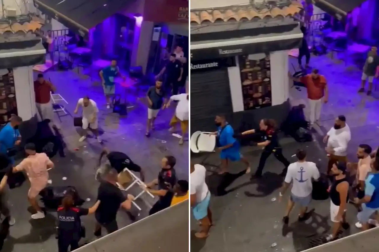 Drinkers smash chairs and beer bottles on each other in wild brawl on popular Spanish tourist spot