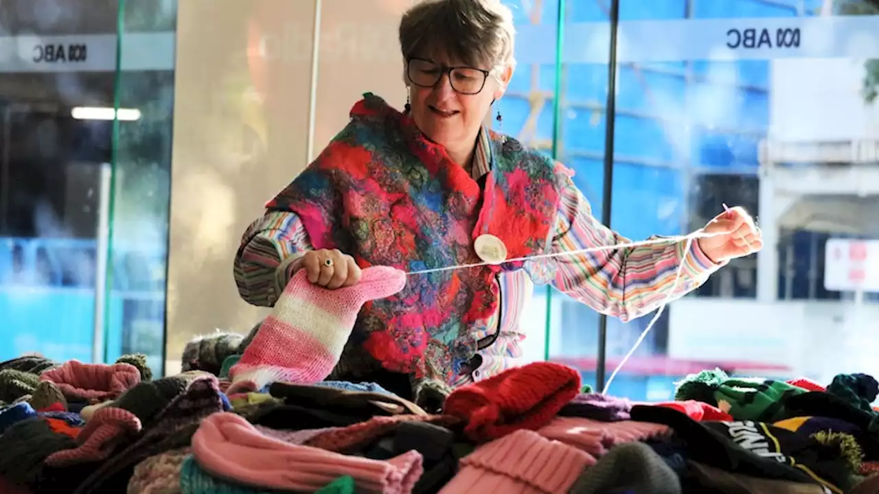 Queenslanders stitch thousands of beanies for those in need