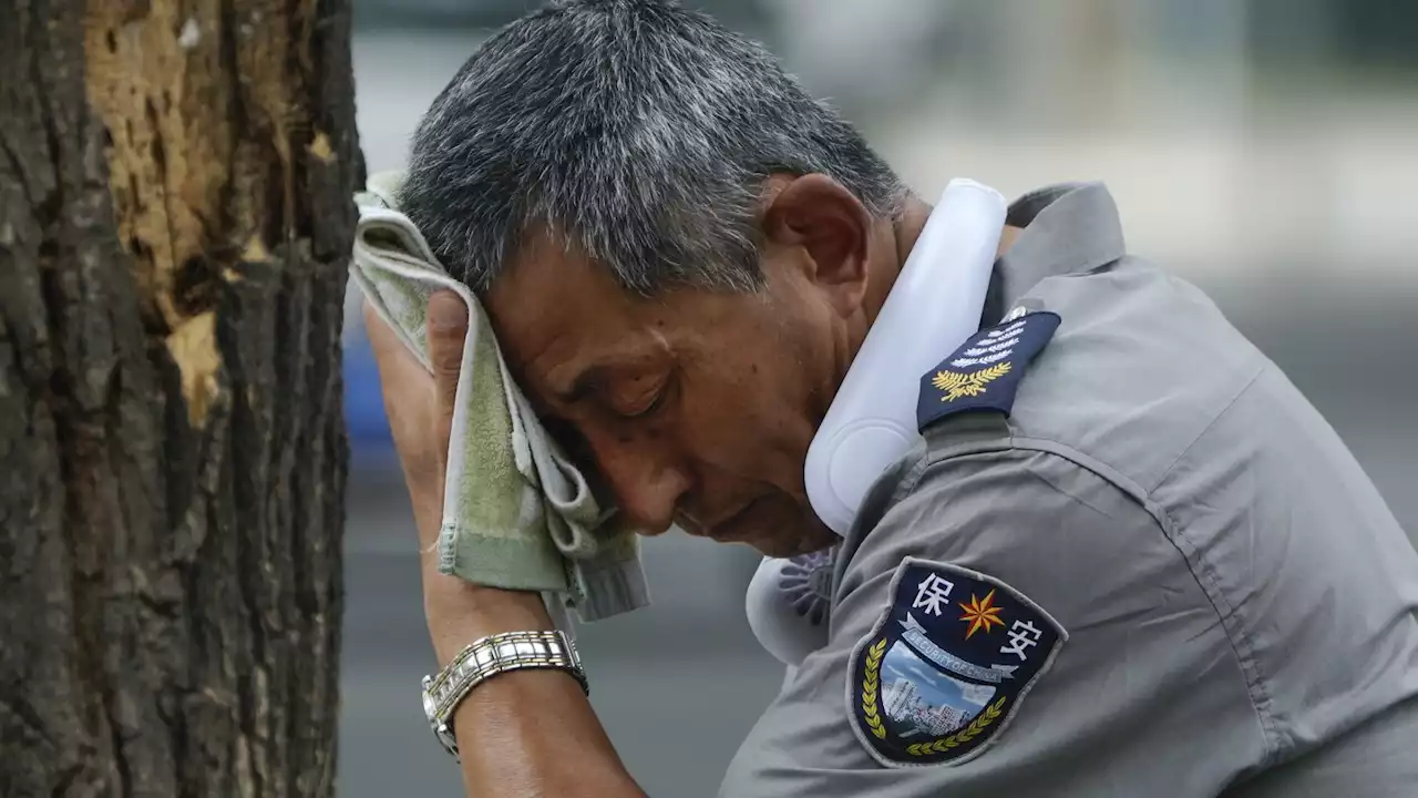 Flooding displaces 10,000 around China as Beijing gets a relative respite from sweltering heat