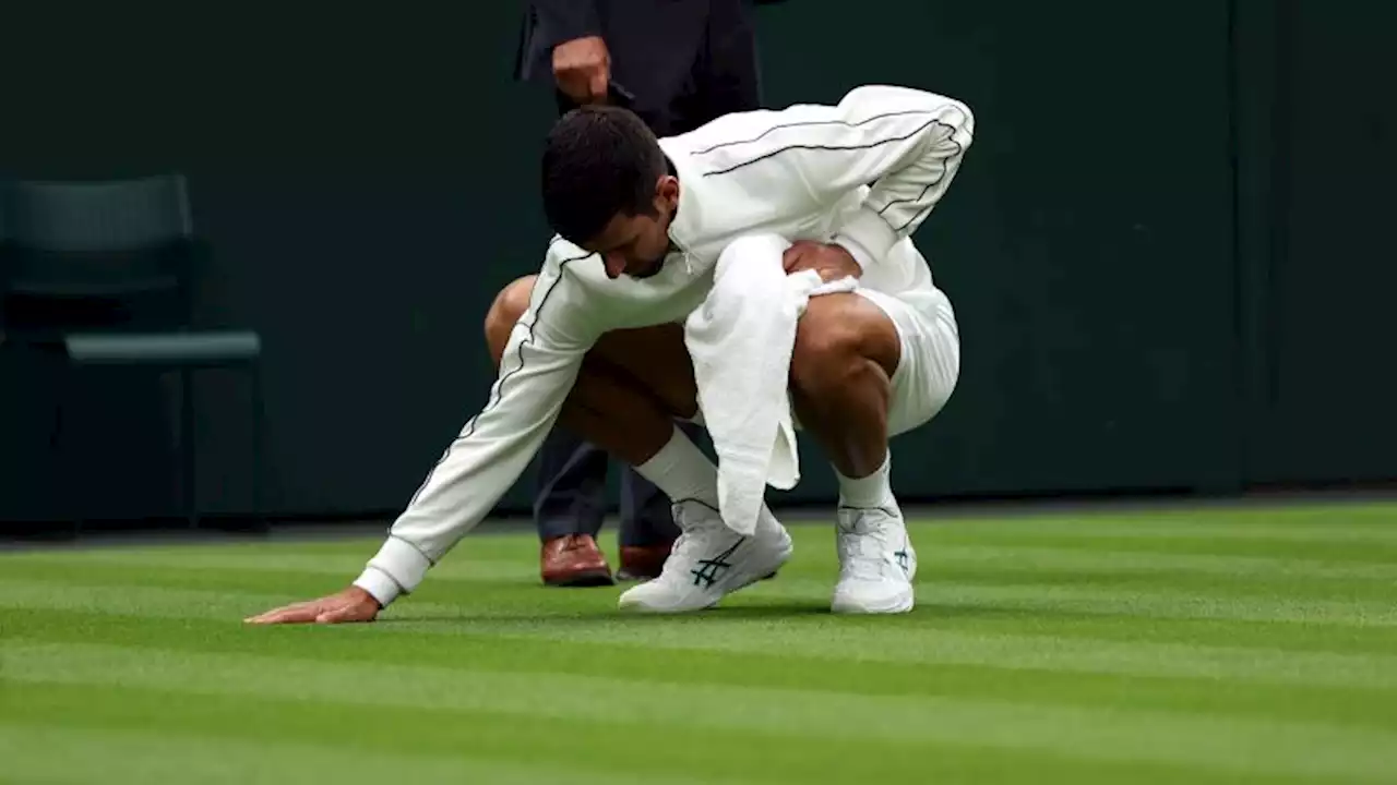 Novak Djokovic takes on grass-drying duties during first-round victory at Wimbledon | CNN