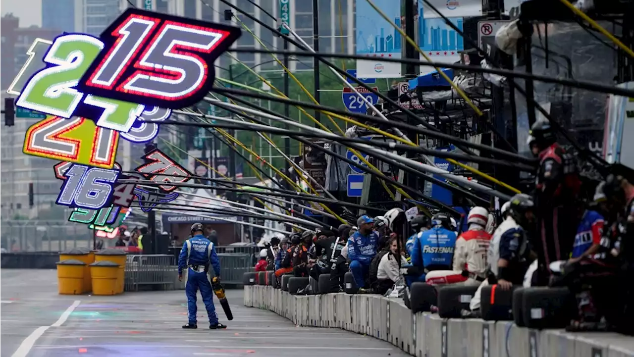 Heavy rains flood Chicago roads and force NASCAR to cut short a downtown street race