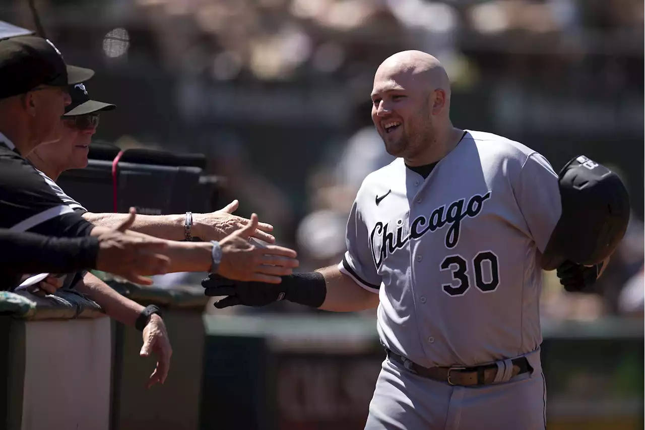 Burger hits 18th homer, White Sox hold off A's 8-7 to avoid a sweep