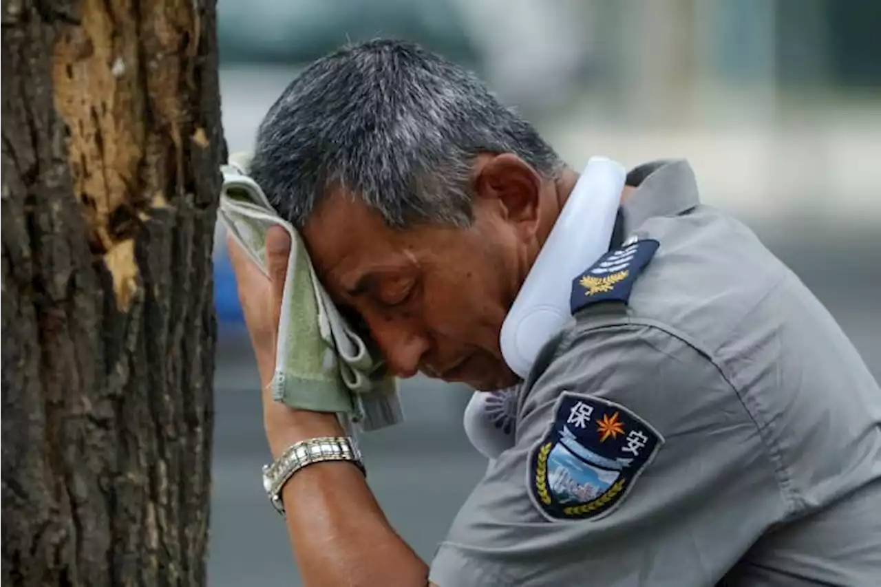 Flooding displaces 10,000 around China as Beijing gets a relative respite from sweltering heat