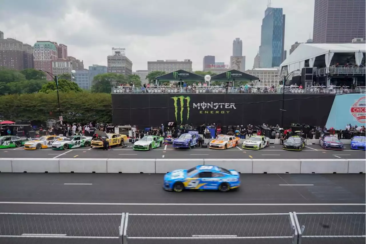 Heavy rains flood Chicago roads and force NASCAR to cut short a downtown street race