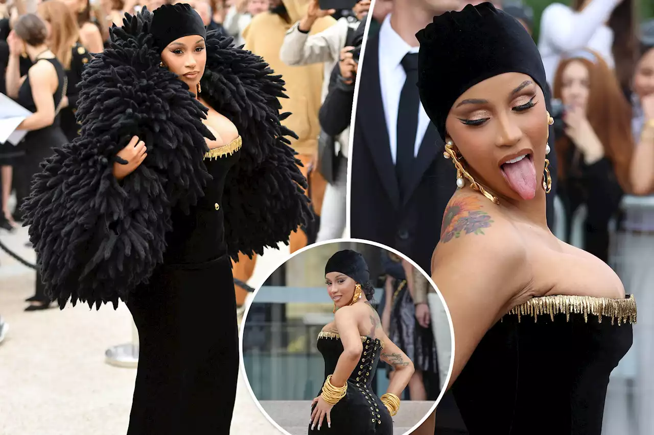 Cardi B delivers drama at Paris Fashion Week in corseted, cloaked couture