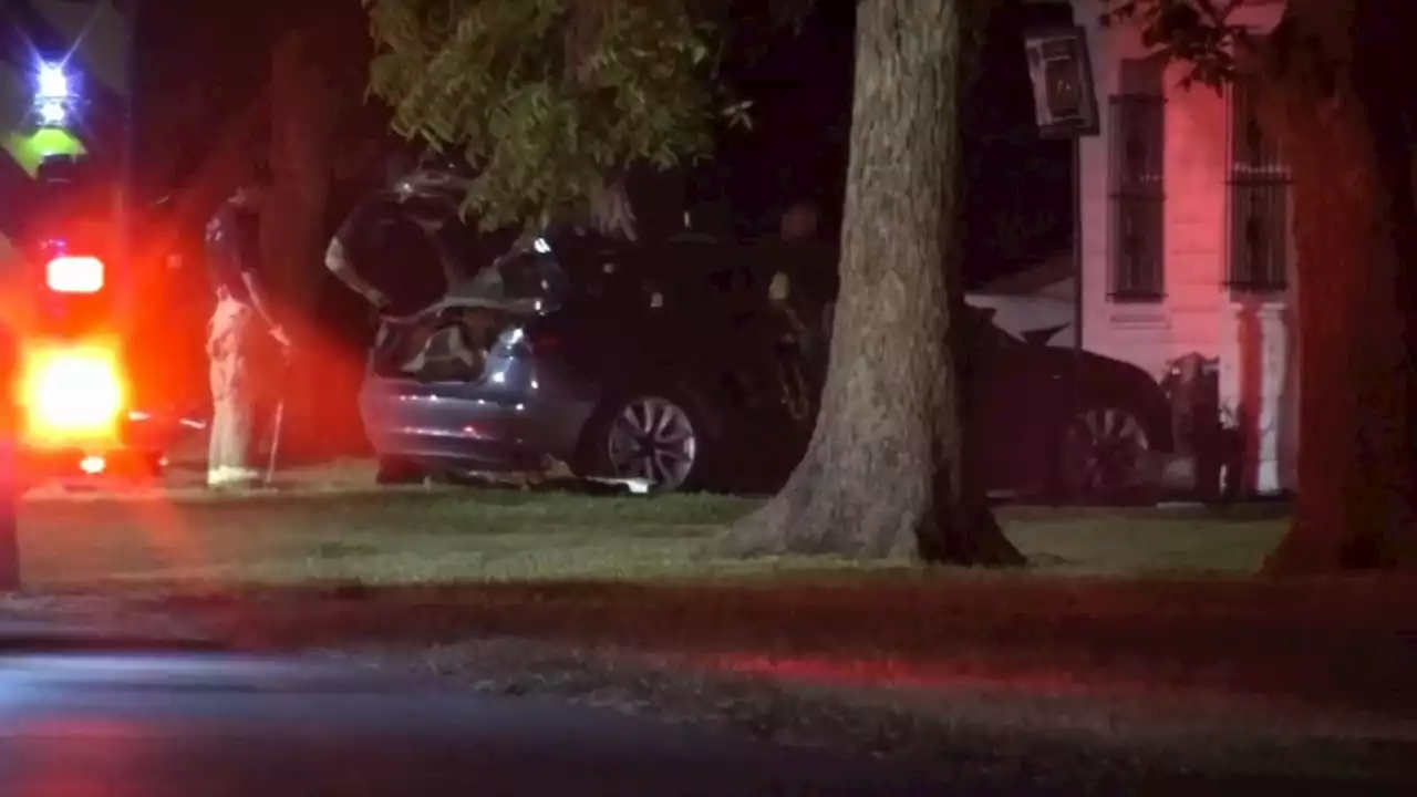 Driver killed, woman rescued from burning Tesla that crashed into tree and hit nearby home, HPD says