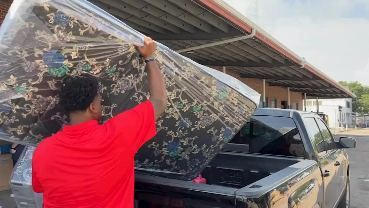 Strength to good use, good cause: University of Houston linemen help distribute mattresses