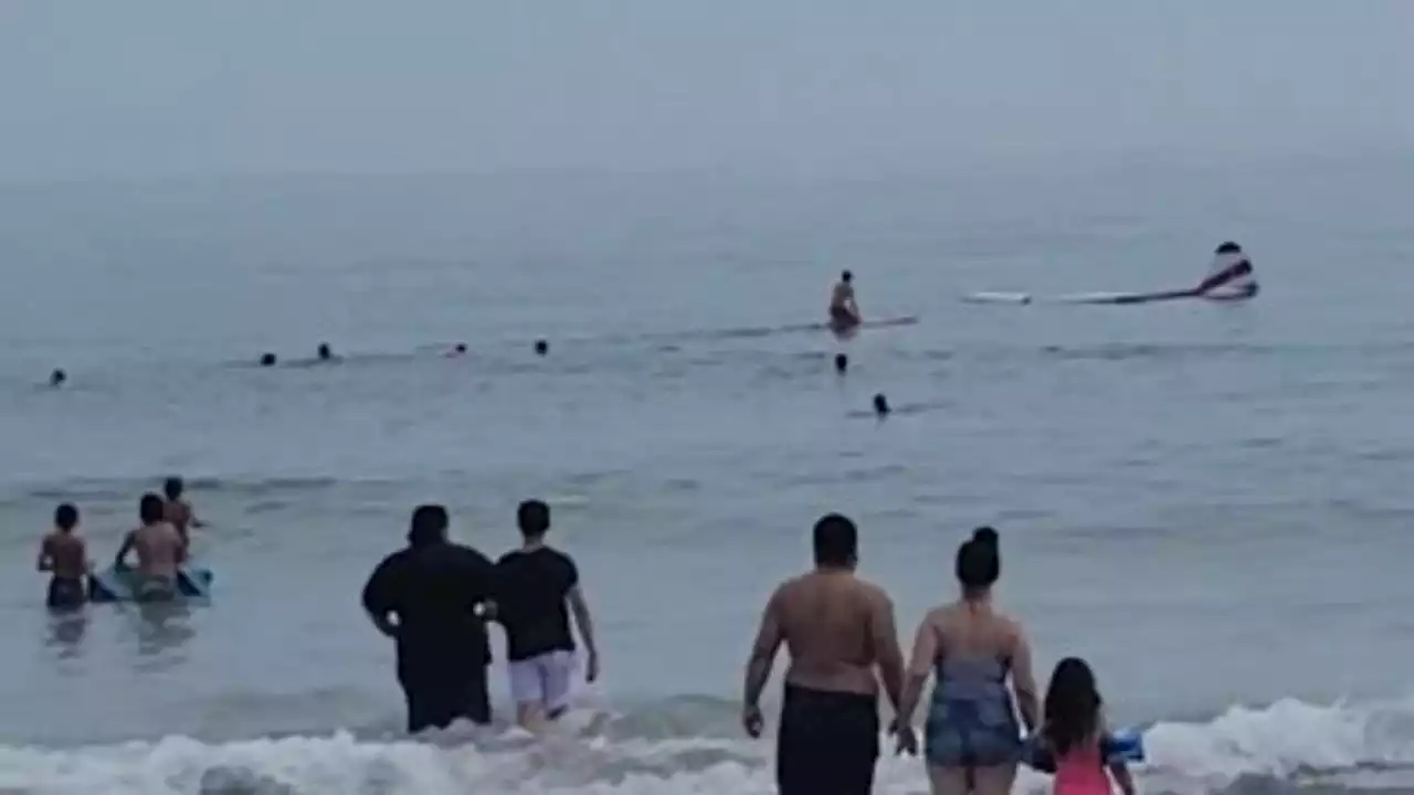 Small plane lands in ocean off crowded New Hampshire beach