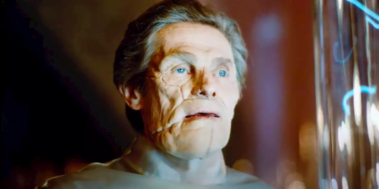 Willem Dafoe Sits at the Head of the Table in New 'Poor Things' Image