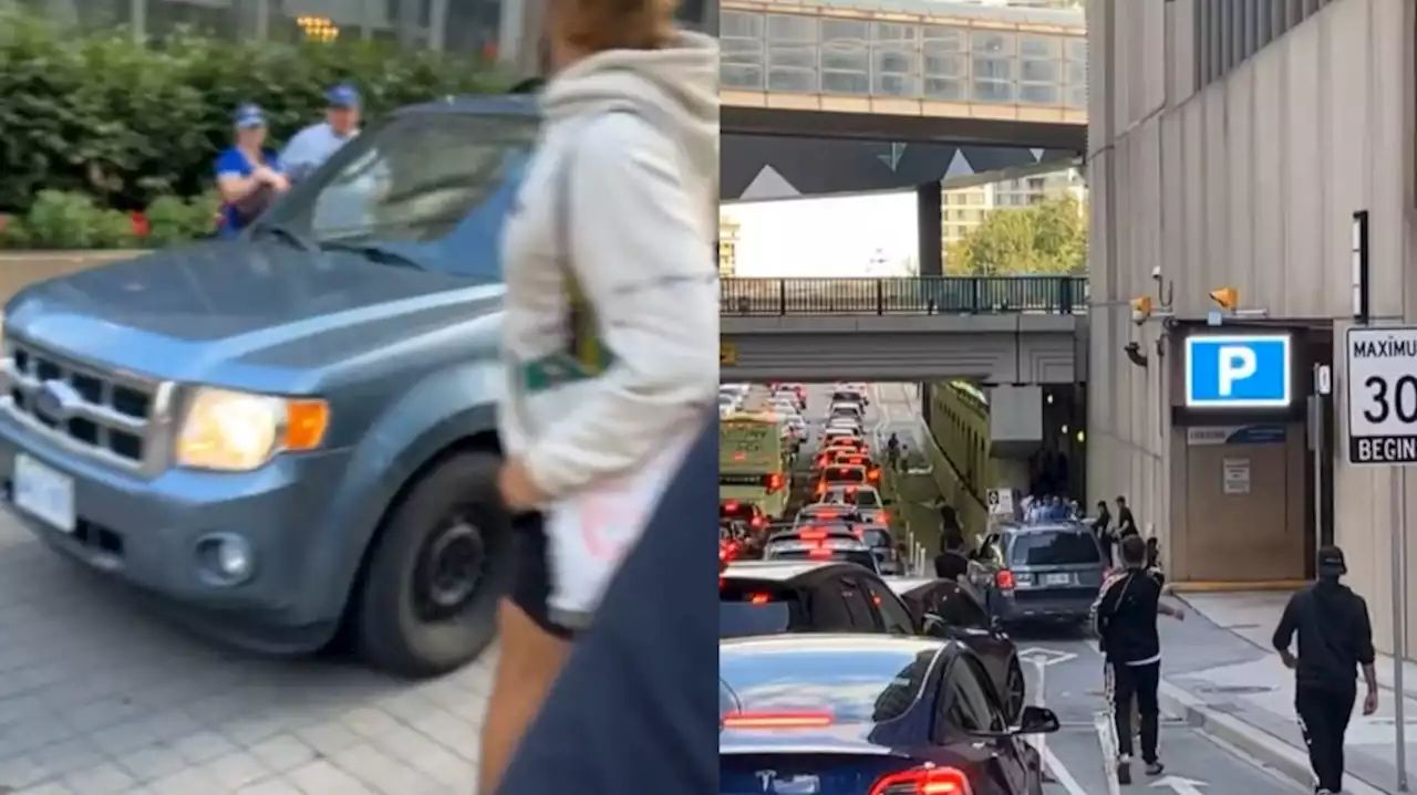 Video surfaces of car driving onto sidewalk, nearly hitting dozens of pedestrians in downtown Toronto