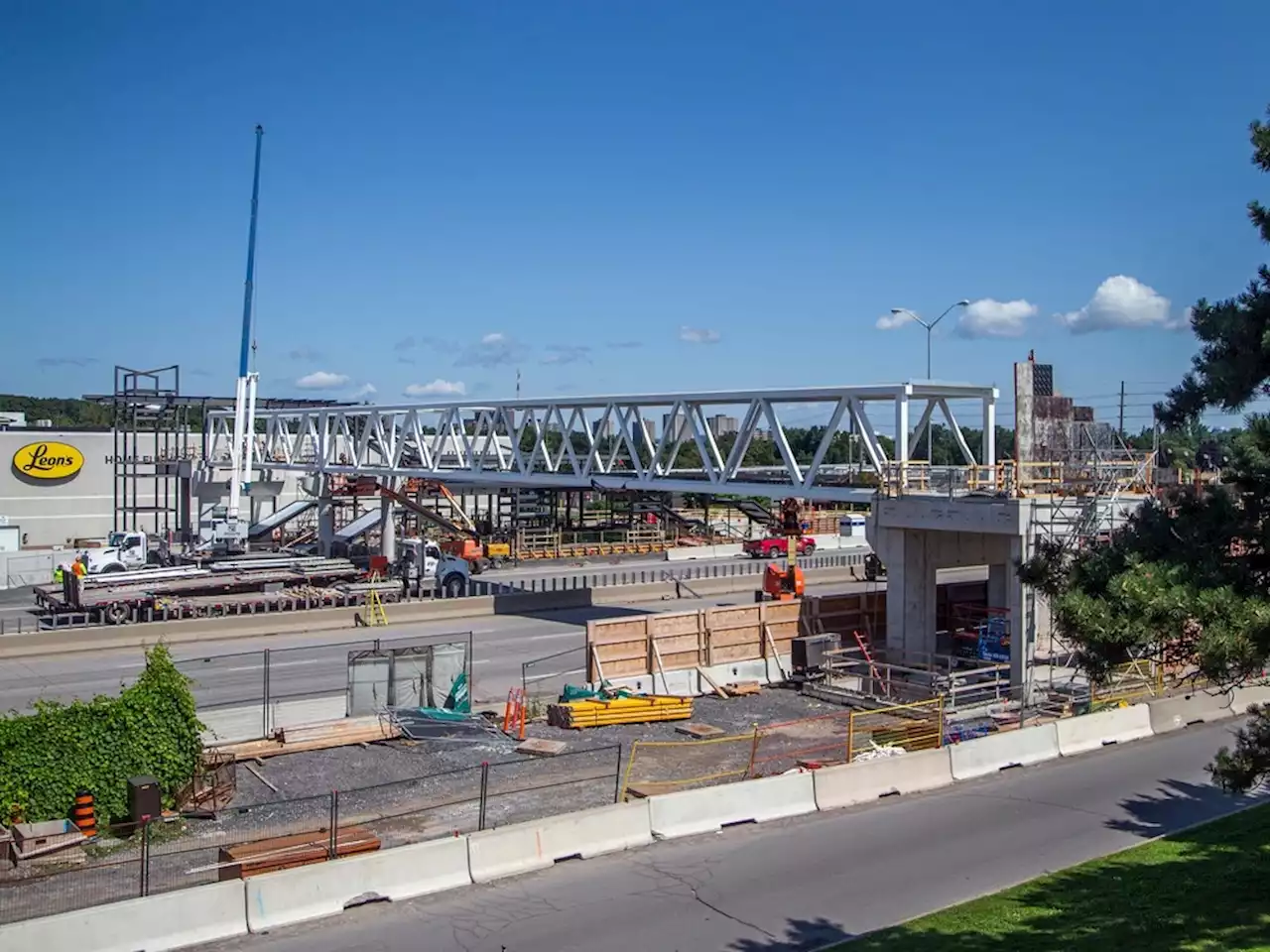 Western section of Queensway to re-open Monday morning following installation of pedestrian bridge