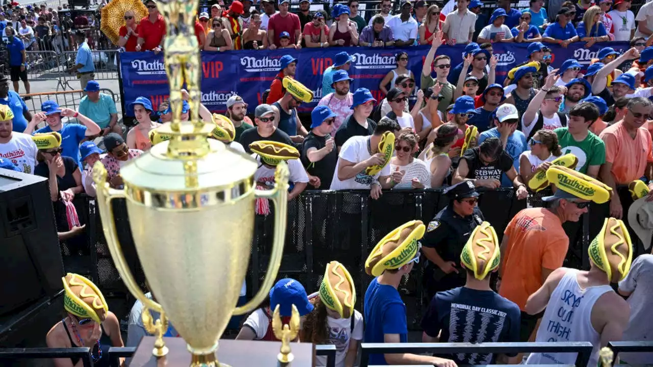 Joey Chestnut wins men's hot dog eating contest after weather delay