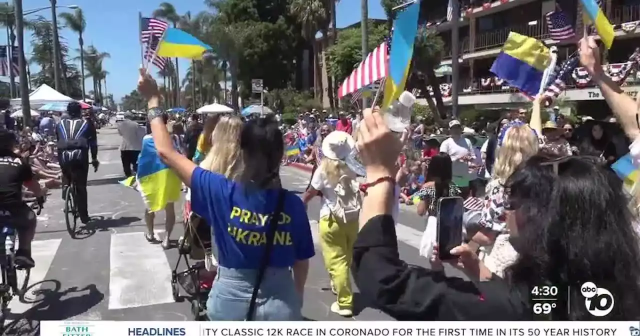 Ukrainian refugees walk in Coronado's Fourth of July parade