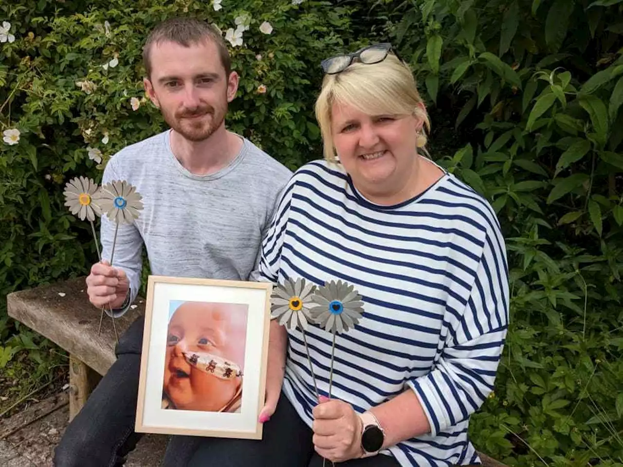 Parents support Hope House hospices with daisies in their beloved son's memory