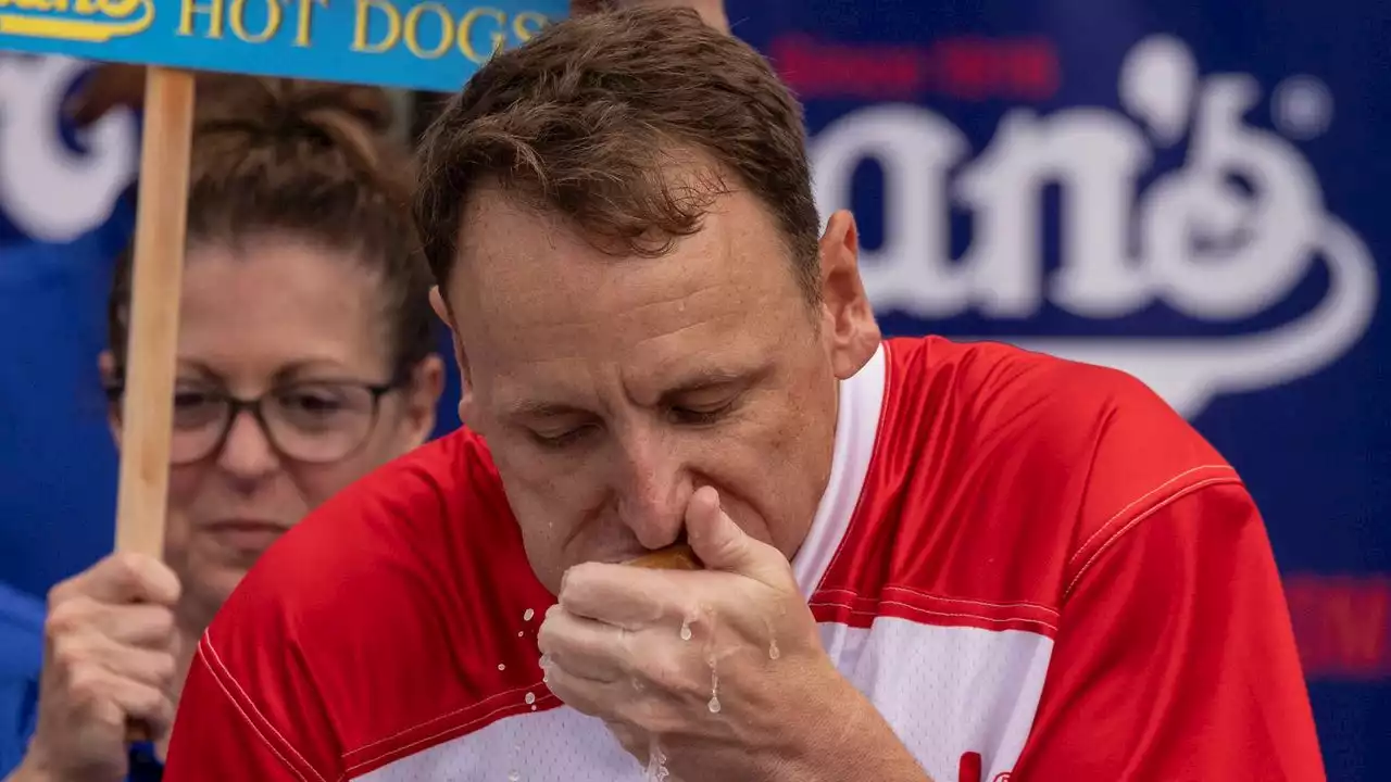 Joey Chestnut shakes off rain delay and defends hot dog title