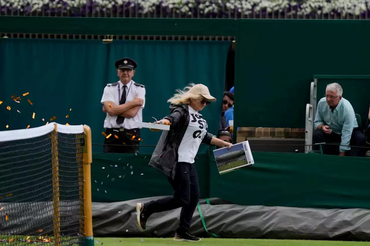 Just Stop Oil protesters throw orange confetti onto court at Wimbledon