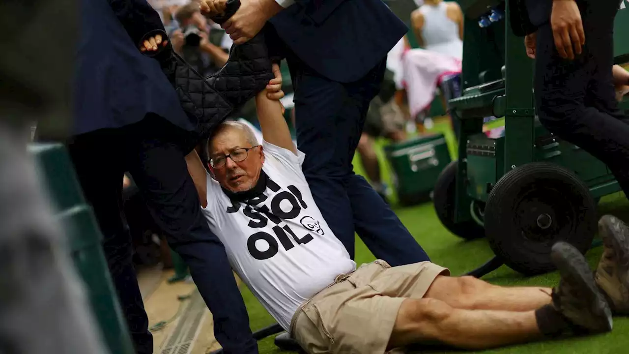 Wimbledon: Demonstrators dragged off after dumping confetti on grass courts to protest fossil fuels