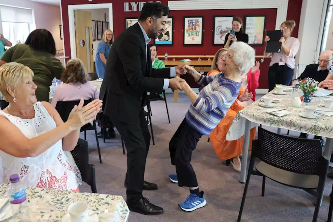 Humza Yousaf dances and chats with care home residents