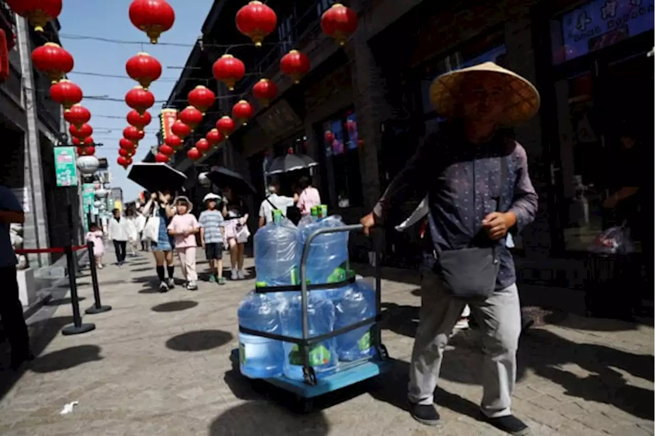 Northern cities in China brace for another day of torrid heat