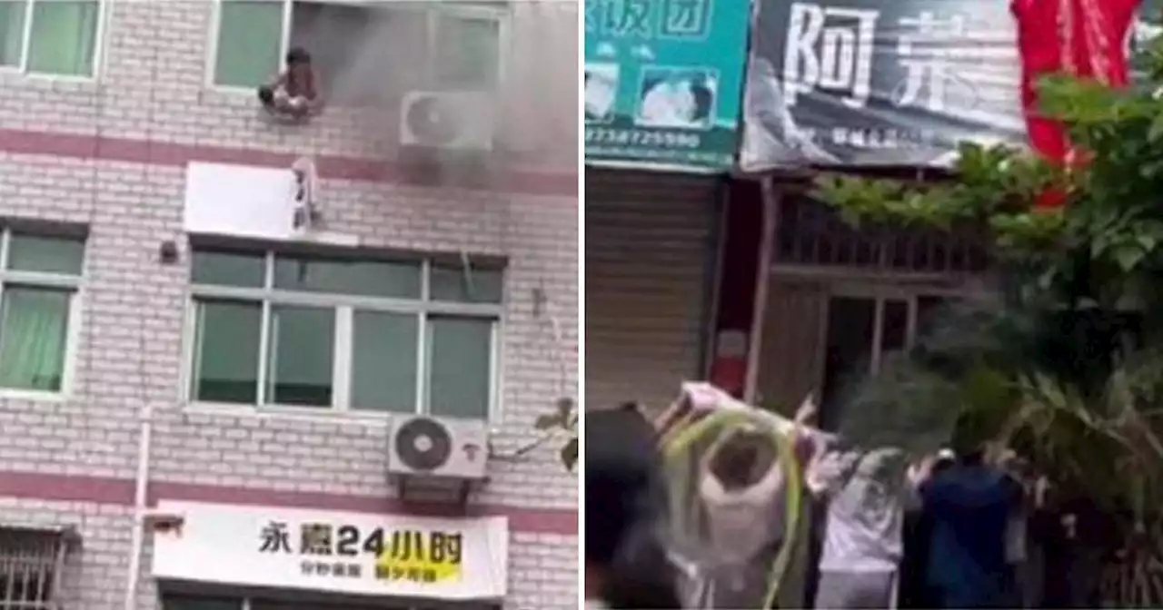 Mum throws six-week-old baby from fourth floor of burning building