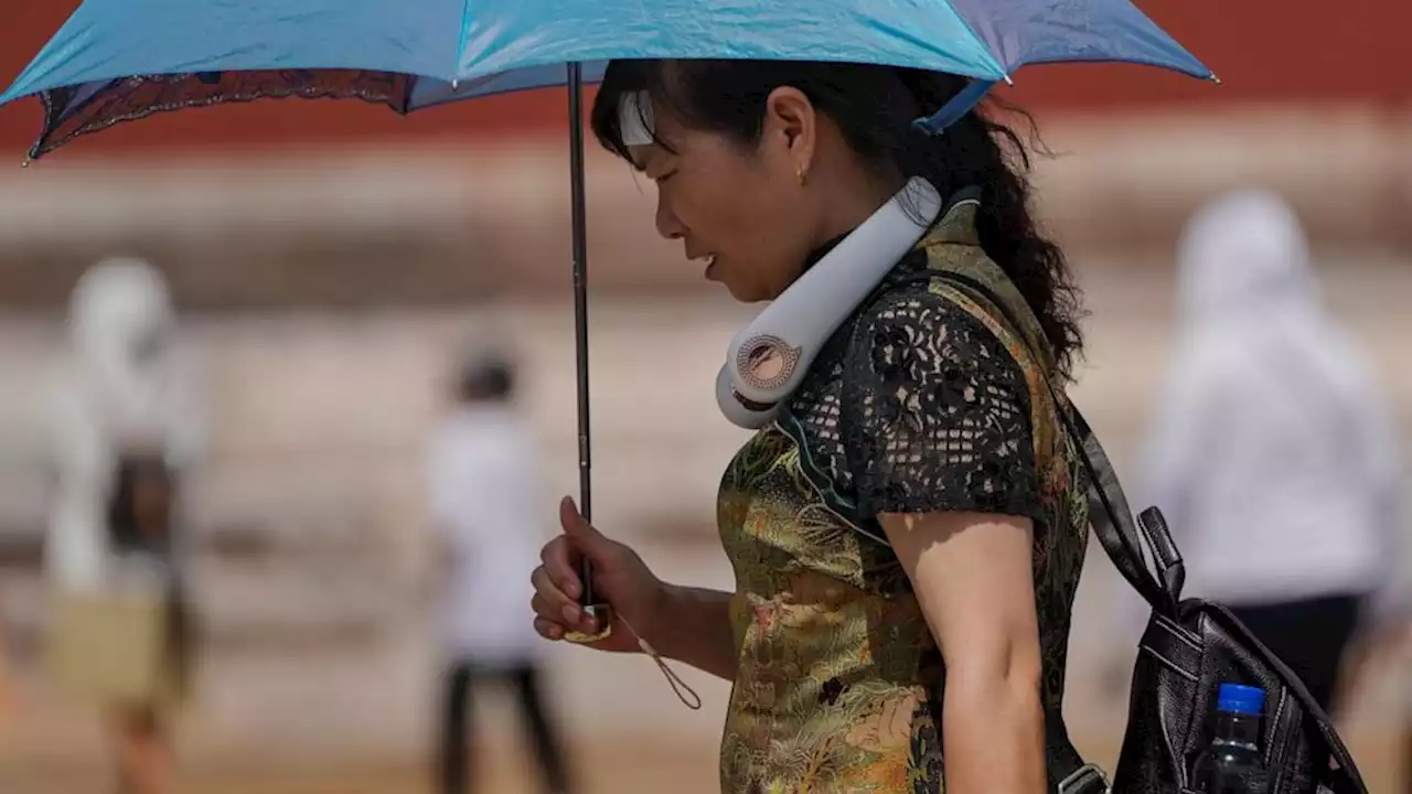 9 missing in China landslide sparked by heavy rains amid flooding and searing temperatures