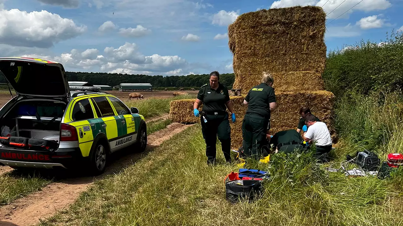 Farmer nearly crushed by huge bale of hay is saved by father of two